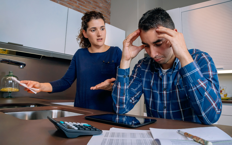 debts reviewing their bills - Mid America Debt Relief